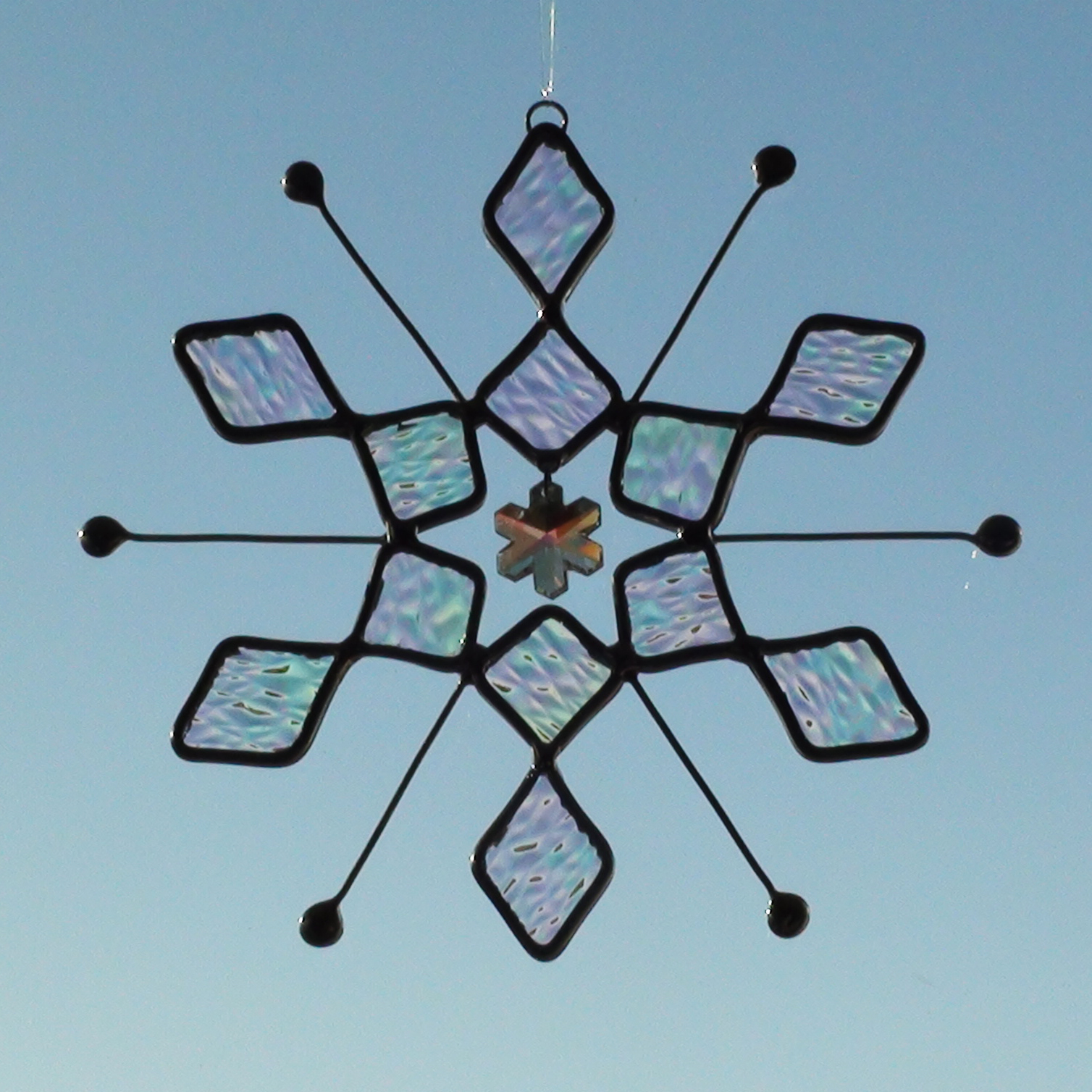 Large Sun Catcher created from Stained Glass with an Iridescent Snowflake Design and Crystal Snowflake in the Middle